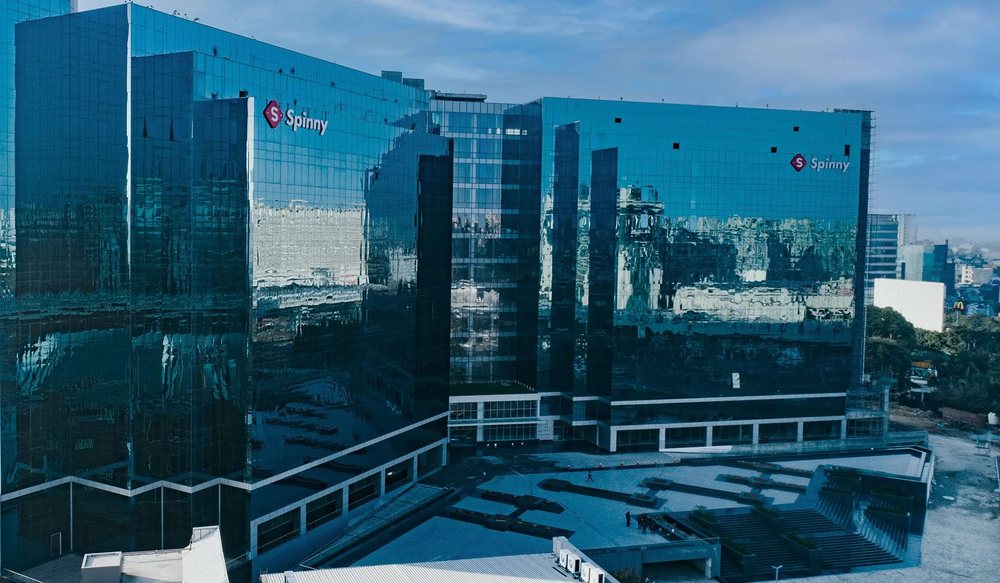 Hans Business Park's blue-glass office towers with tenant signage